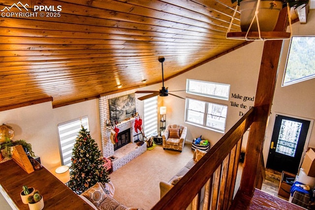 105 Pauma Valley Dr, Colorado Springs, CO 80921 - living area featuring wood ceiling, a fireplace, vaulted ceiling, and ceiling fan
