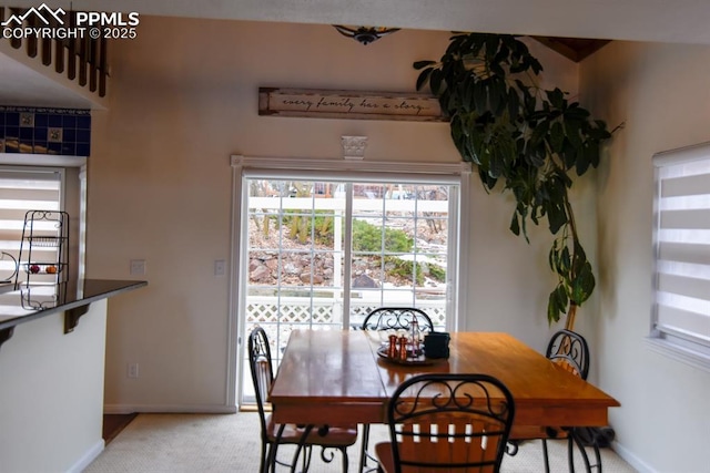 105 Pauma Valley Dr, Colorado Springs, CO 80921 - dining room with baseboards and light colored carpet