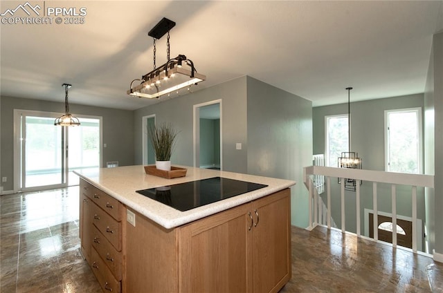 16070 Buggywhip Dr, Elbert, CO 80106 - kitchen with black electric stovetop, healthy amount of natural light, pendant lighting, and a kitchen island