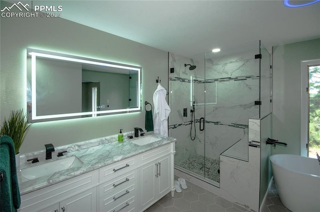 16070 Buggywhip Dr, Elbert, CO 80106 - bathroom with a marble finish shower, double vanity, a freestanding tub, tile patterned flooring, and recessed lighting
