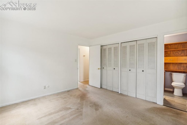 119 Arlen St, Colorado Springs, CO 80909 - unfurnished bedroom featuring two closets, carpet floors, baseboards, and connected bathroom