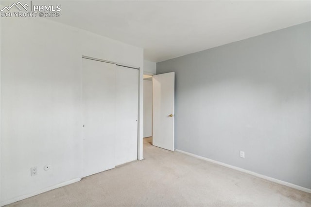 119 Arlen St, Colorado Springs, CO 80909 - unfurnished bedroom featuring carpet floors, a closet, and baseboards