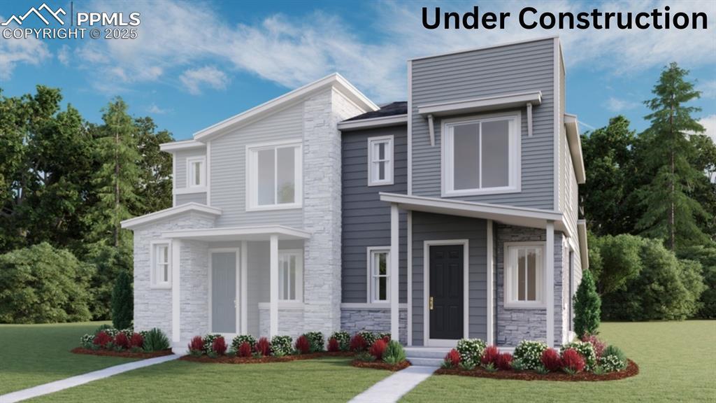 2459 Vanhoutte Vw, Colorado Springs, CO 80915 - contemporary home with stone siding and a front lawn