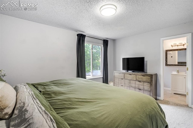 13072 Westlake Pl, Broomfield, CO 80020 - bedroom featuring light carpet, a textured ceiling, and ensuite bath