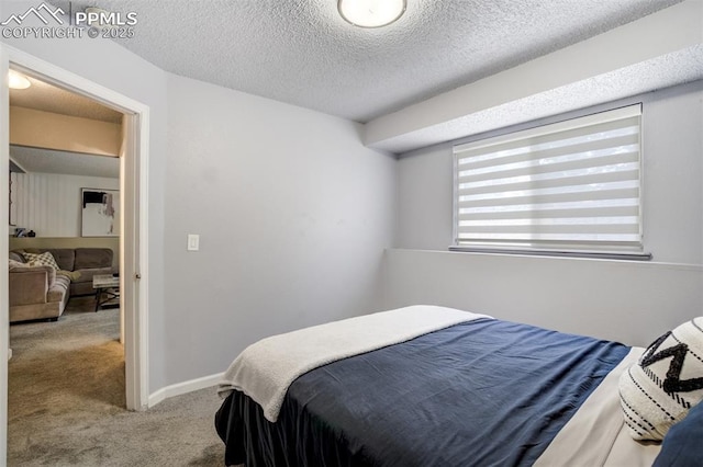 13072 Westlake Pl, Broomfield, CO 80020 - carpeted bedroom with a textured ceiling and baseboards