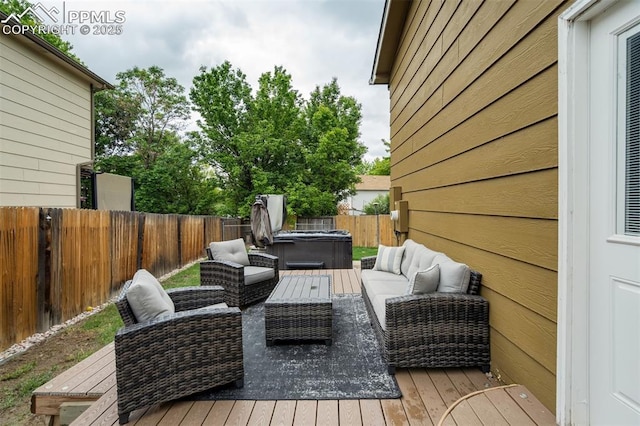 13072 Westlake Pl, Broomfield, CO 80020 - wooden deck featuring a hot tub, an outdoor living space, and a fenced backyard