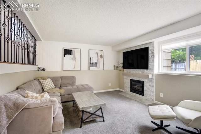 13072 Westlake Pl, Broomfield, CO 80020 - carpeted living room featuring a textured ceiling, a fireplace, and baseboards