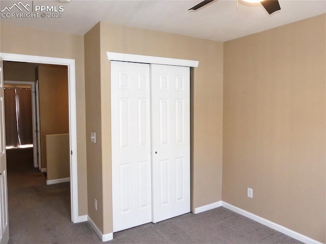 828 S Wahsatch Ave, Colorado Springs, CO 80903 - unfurnished bedroom featuring dark carpet, a closet, baseboards, and a ceiling fan