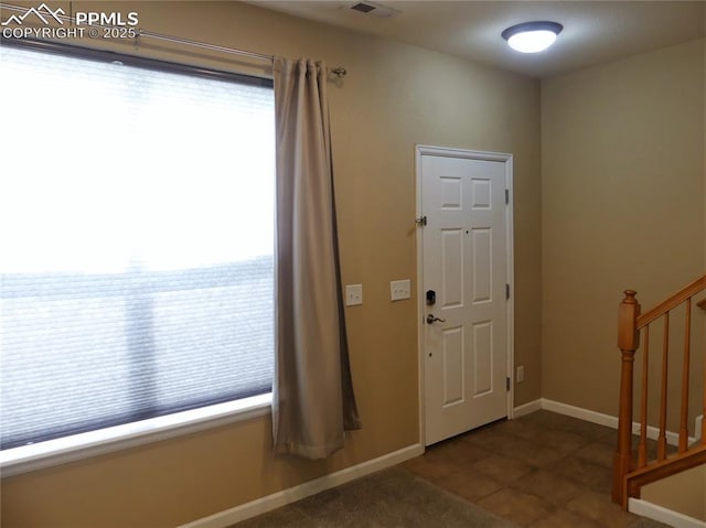 828 S Wahsatch Ave, Colorado Springs, CO 80903 - entryway with stairs, baseboards, and tile patterned flooring