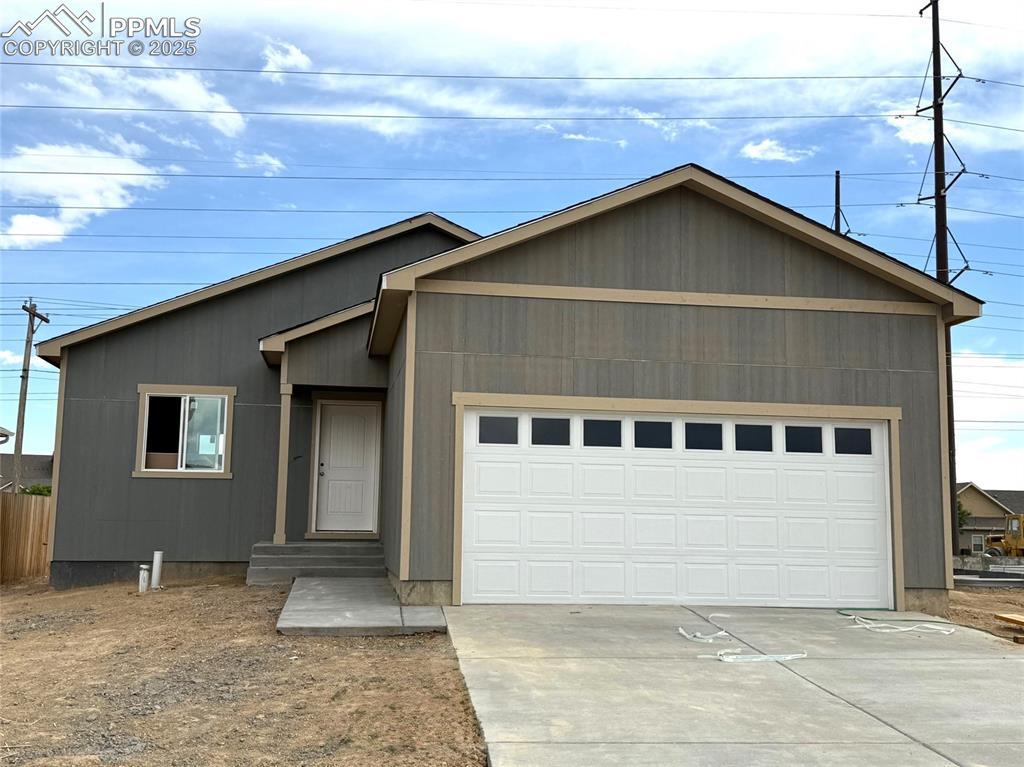 5220 Gannet Ln, Pueblo, CO 81008 - single story home with an attached garage and driveway