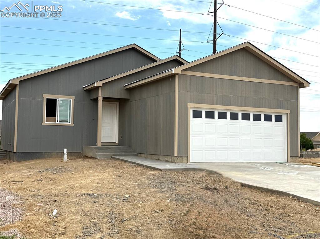 5220 Gannet Ln, Pueblo, CO 81008 - single story home featuring a garage and driveway