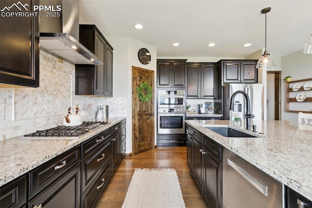 4808 Silver Nell Dr, Colorado Springs, CO 80908 - kitchen featuring wall chimney range hood, a sink, appliances with stainless steel finishes, light stone countertops, and pendant lighting