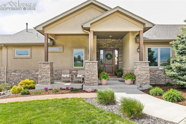 4808 Silver Nell Dr, Colorado Springs, CO 80908 - doorway to property with stone siding, a porch, stucco siding, a lawn, and roof with shingles