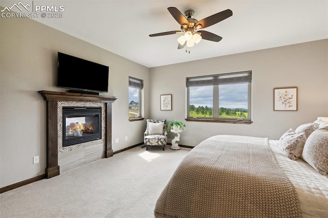 4808 Silver Nell Dr, Colorado Springs, CO 80908 - carpeted bedroom with a tile fireplace, baseboards, and ceiling fan