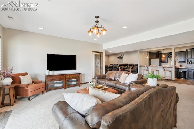 4808 Silver Nell Dr, Colorado Springs, CO 80908 - living room featuring light colored carpet, recessed lighting, a chandelier, and bar