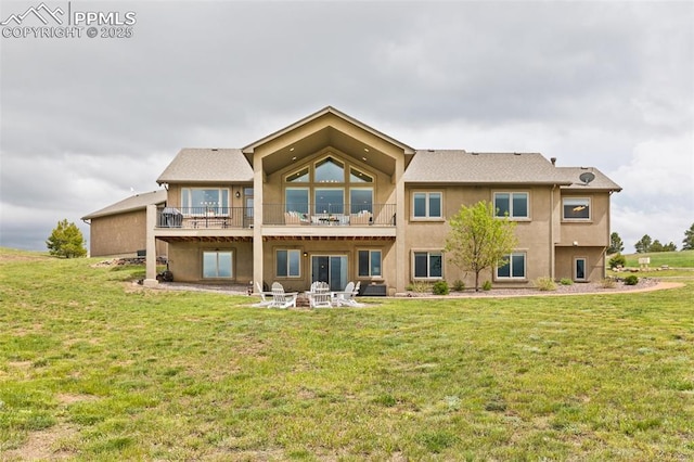 4808 Silver Nell Dr, Colorado Springs, CO 80908 - back of property featuring a lawn, a balcony, and stucco siding