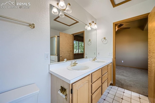 5437 Lions Gate Ln, Colorado Springs, CO 80919 - full bathroom featuring double vanity, a shower with shower door, and tile patterned floors