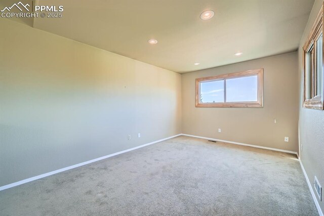 5437 Lions Gate Ln, Colorado Springs, CO 80919 - carpeted spare room featuring baseboards and recessed lighting