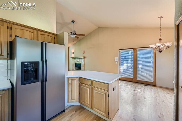 5437 Lions Gate Ln, Colorado Springs, CO 80919 - kitchen featuring stainless steel fridge with ice dispenser, a chandelier, light countertops, a ceiling fan, and light wood-type flooring