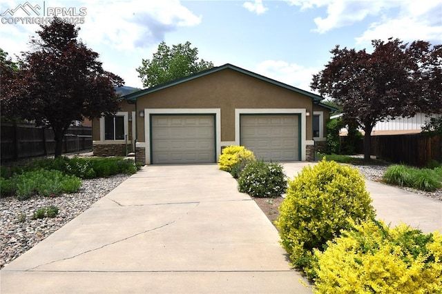 1310-1312 Market St, Colorado Springs, CO 80904 - single story home with stone siding, driveway, stucco siding, and an attached garage