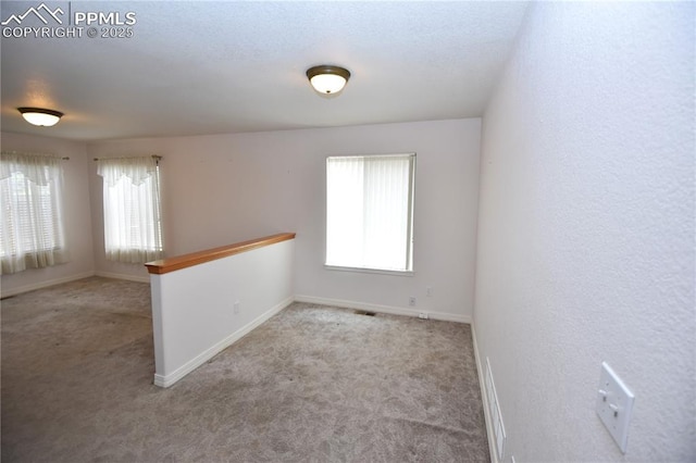 1310-1312 Market St, Colorado Springs, CO 80904 - carpeted empty room featuring baseboards