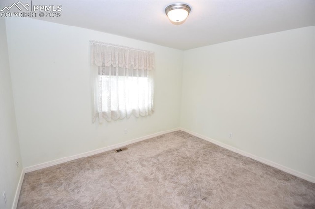 1310-1312 Market St, Colorado Springs, CO 80904 - carpeted empty room featuring baseboards