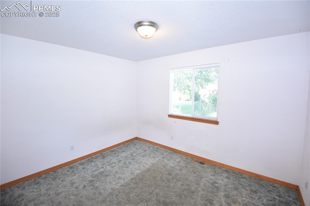 1310-1312 Market St, Colorado Springs, CO 80904 - carpeted empty room with baseboards