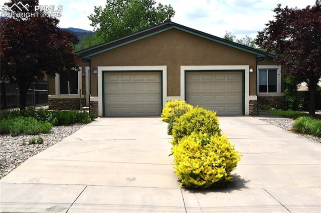 1310-1312 Market St, Colorado Springs, CO 80904 - single story home with stone siding, driveway, and an attached garage