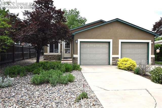 1310-1312 Market St, Colorado Springs, CO 80904 - single story home with stone siding, stucco siding, concrete driveway, and a garage