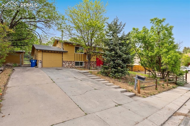 814 Paradise Ln, Colorado Springs, CO 80904 - view of front of property with driveway and a garage