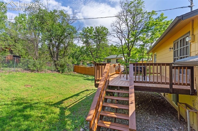 814 Paradise Ln, Colorado Springs, CO 80904 - fenced backyard with a wooden deck and stairway