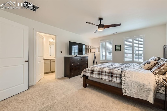 16135 Mountain Flax Dr, Monument, CO 80132 - bedroom featuring light carpet, connected bathroom, and a ceiling fan