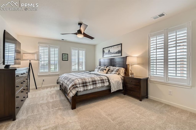 16135 Mountain Flax Dr, Monument, CO 80132 - bedroom with baseboards, light colored carpet, and a ceiling fan