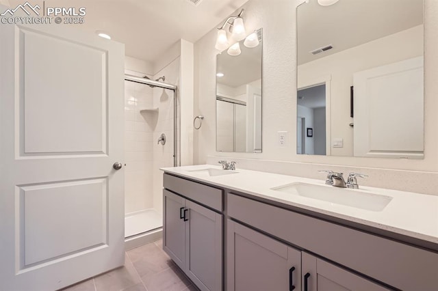 16135 Mountain Flax Dr, Monument, CO 80132 - full bath featuring a stall shower, double vanity, and marble look tiles