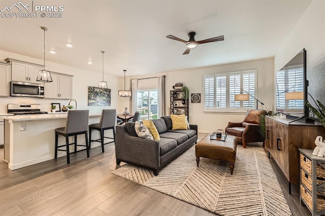 16135 Mountain Flax Dr, Monument, CO 80132 - living area with ceiling fan, light wood-style flooring, and recessed lighting