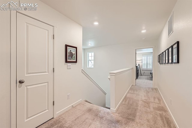 16135 Mountain Flax Dr, Monument, CO 80132 - hallway with an upstairs landing, light carpet, recessed lighting, and baseboards