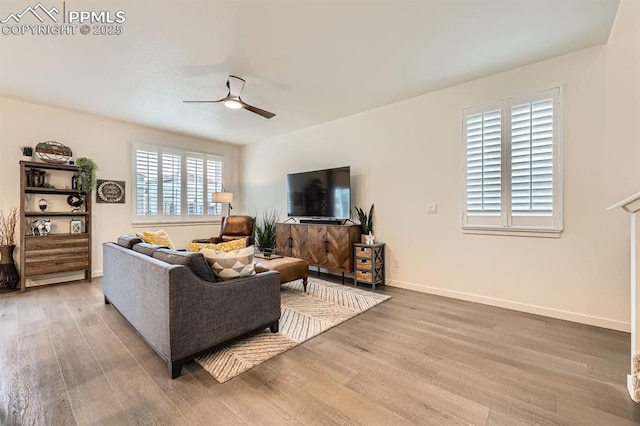 16135 Mountain Flax Dr, Monument, CO 80132 - living area with ceiling fan, wood finished floors, and baseboards