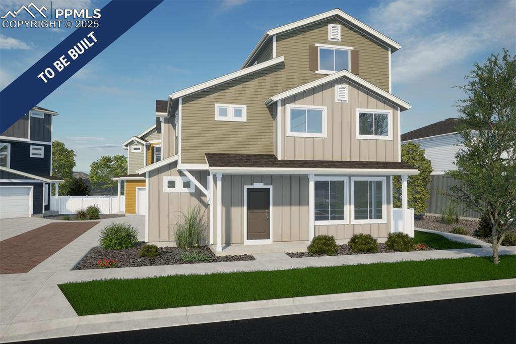 5632 Dakan Loop, Colorado Springs, CO 80927 - view of front of house featuring board and batten siding, decorative driveway, and a shingled roof