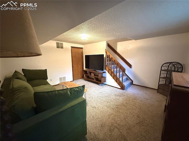1660 Maitland Ct, Colorado Springs, CO 80919 - carpeted living room with a textured ceiling and stairs