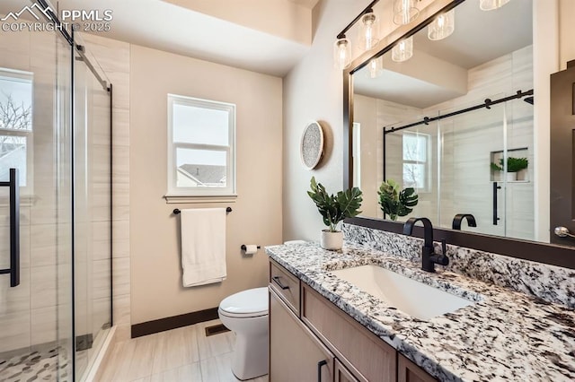 5687 Marshall Creek Dr, Colorado Springs, CO 80924 - full bathroom with toilet, vanity, a stall shower, and plenty of natural light
