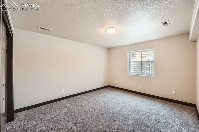 5687 Marshall Creek Dr, Colorado Springs, CO 80924 - spare room with carpet floors, a textured ceiling, and baseboards