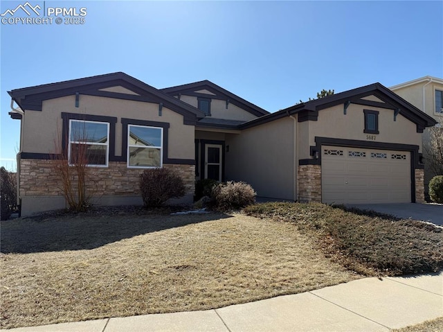 5687 Marshall Creek Dr, Colorado Springs, CO 80924 - single story home with stone siding, stucco siding, a garage, and concrete driveway