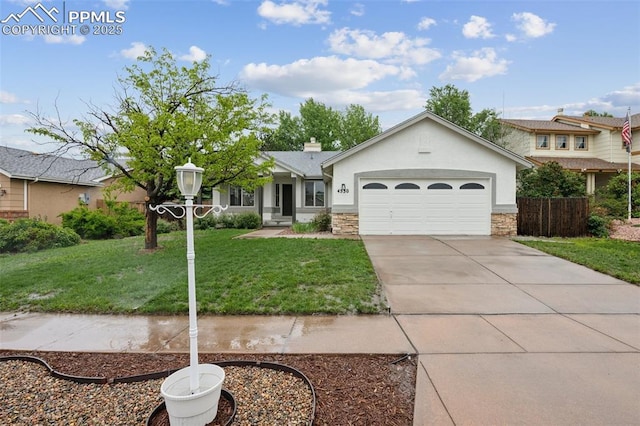 4530 Star Ridge Dr, Colorado Springs, CO 80916 - single story home featuring an attached garage, a front lawn, stucco siding, stone siding, and concrete driveway