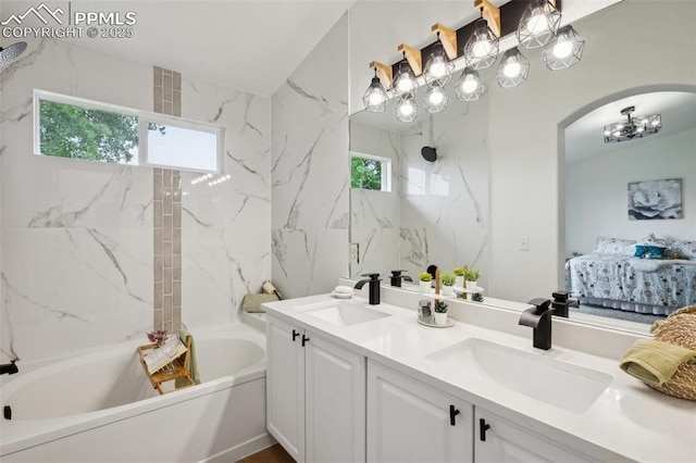 4530 Star Ridge Dr, Colorado Springs, CO 80916 - ensuite bathroom featuring a bath, double vanity, a chandelier, and a shower