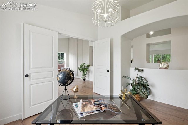 4530 Star Ridge Dr, Colorado Springs, CO 80916 - office area with arched walkways, wood finished floors, baseboards, and a chandelier