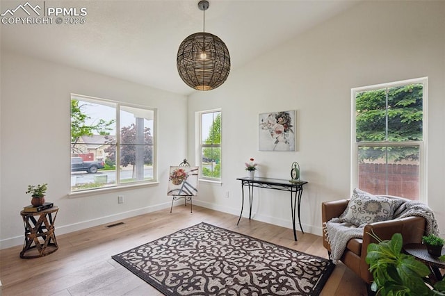 4530 Star Ridge Dr, Colorado Springs, CO 80916 - sitting room featuring light wood-style floors, baseboards, and vaulted ceiling