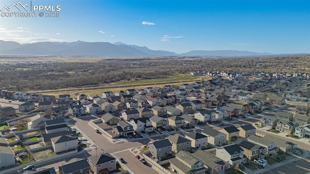 10881 Traders Pkwy, Fountain, CO 80817 - aerial view of property's location with a mountainous background and nearby suburban area