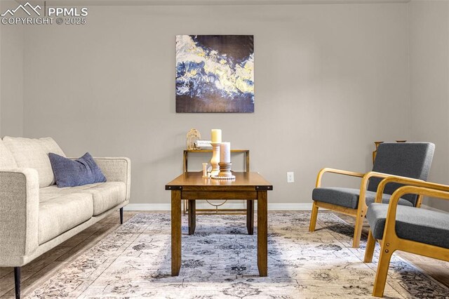 10881 Traders Pkwy, Fountain, CO 80817 - sitting room featuring baseboards and wood finished floors