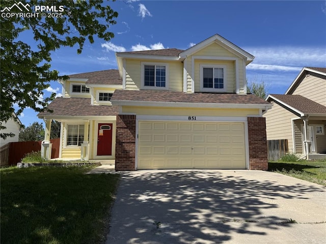 851 Legend Oak Dr, Fountain, CO 80817 - view of front of home featuring brick siding, concrete driveway, a shingled roof, and a garage