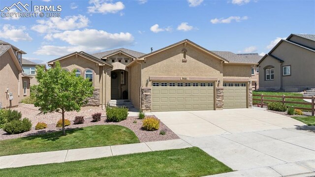 9661 Fresh Air Dr, Colorado Springs, CO 80924 - view of front facade with a garage, concrete driveway, stone siding, and stucco siding